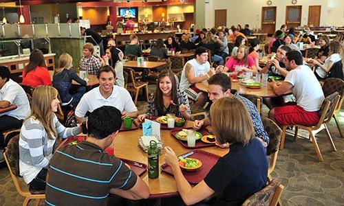 large groups of male and female students having lunch in the Campus Center's Main Dining Hall